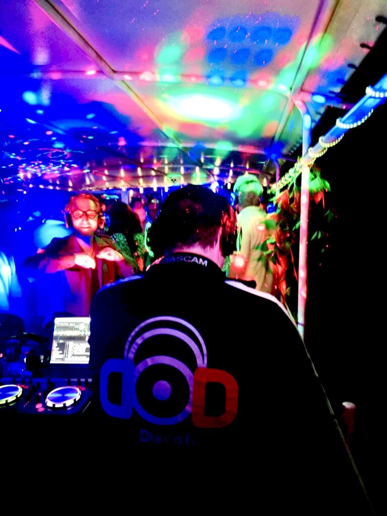 Back of DJ playing music